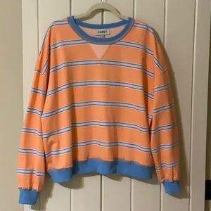 The GREii sweatshirt new in the bag. Size small, oversized. Blue & orange